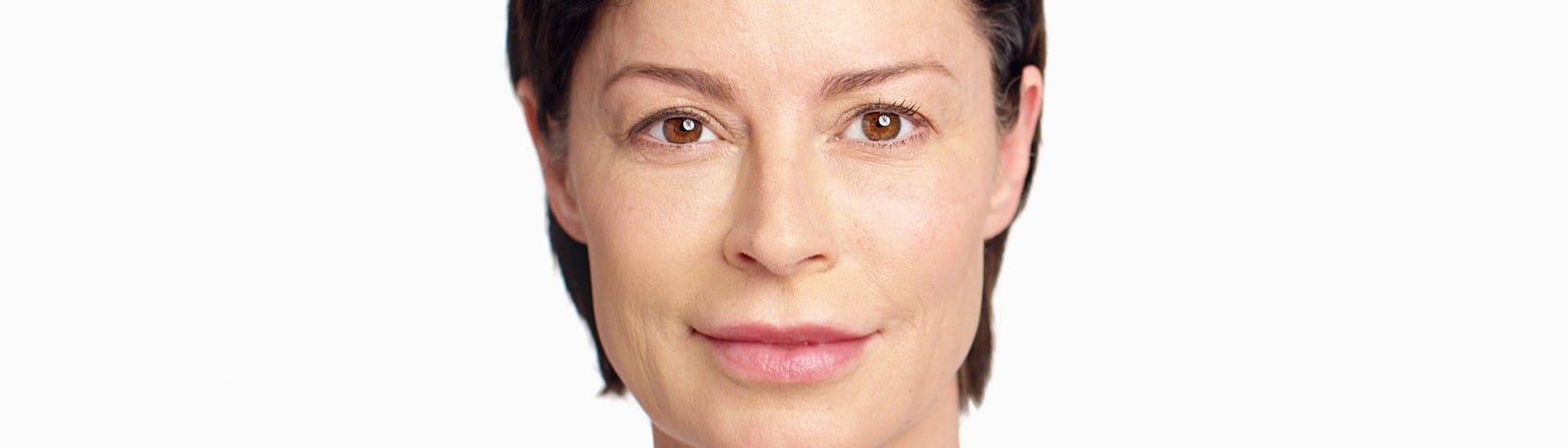 close up photo of a Caucasian woman with short hair with smooth and tight facial skin